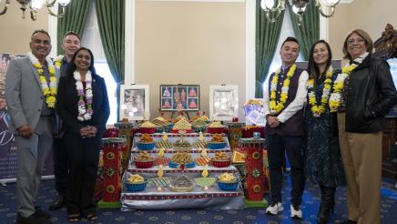 Group photo of members with decorated table