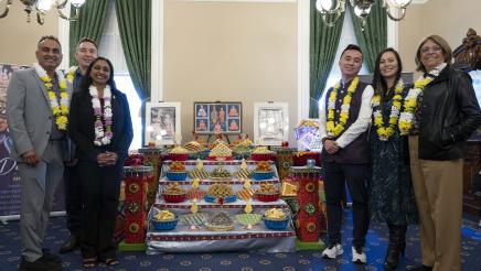 Group photo of members with decorated table